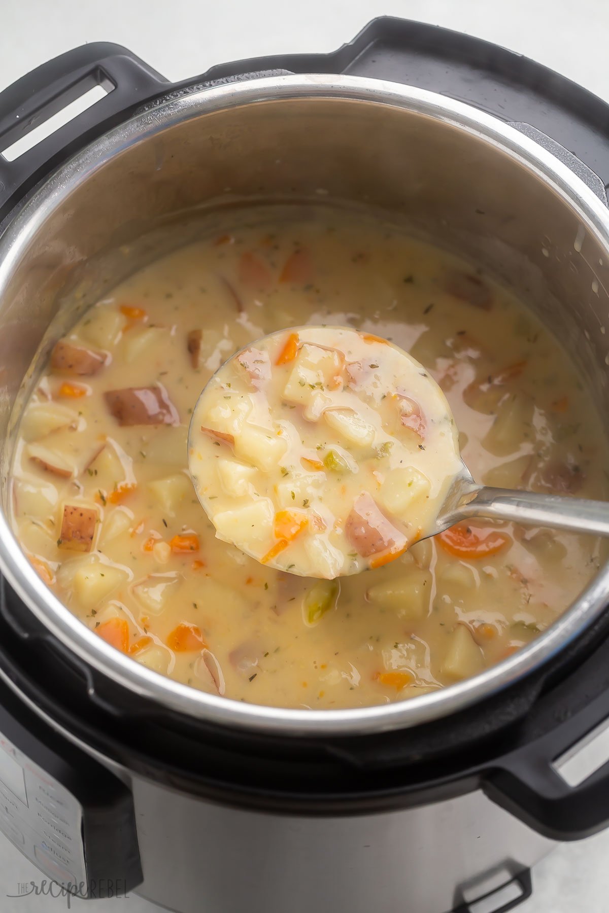 potato soup being ladled out of instant pot.