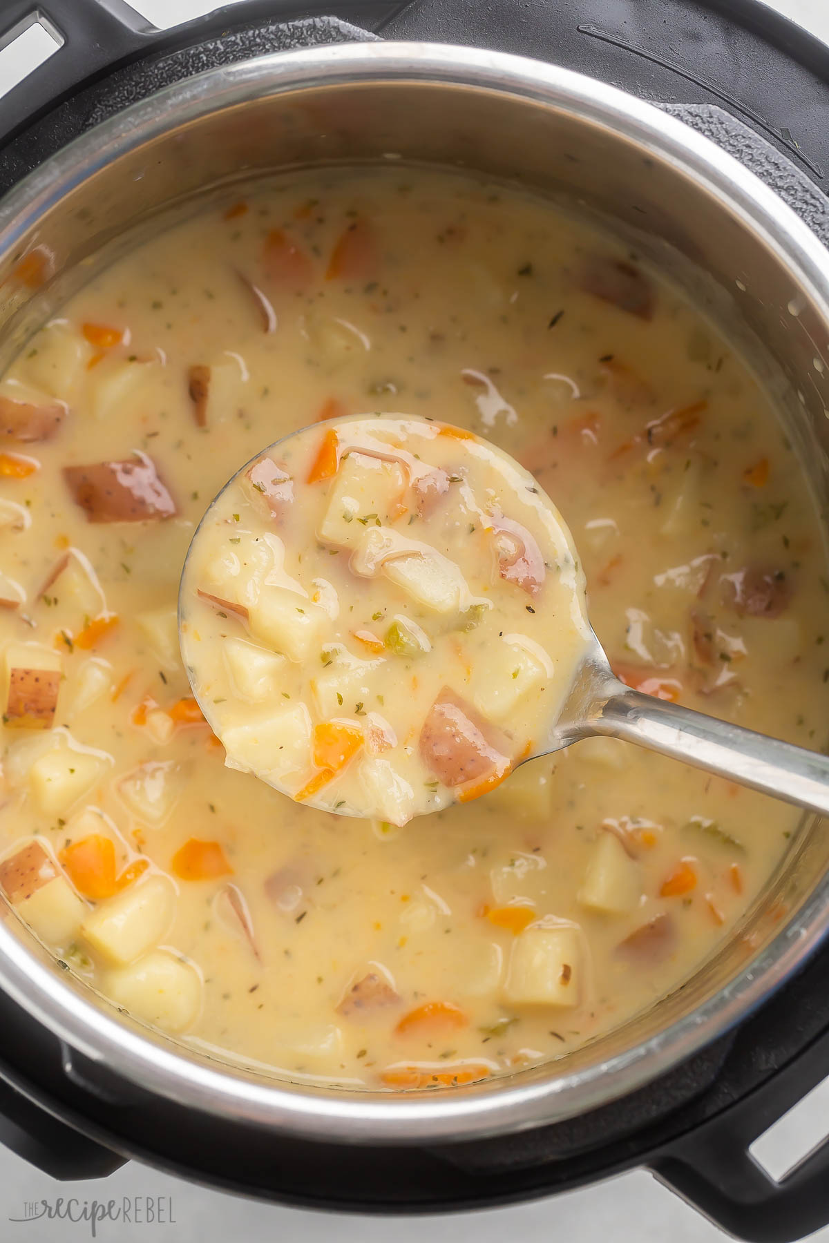 overhead shot of potato soup in instant pot being scooped.