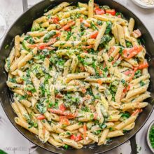 close up shot of pasta primavera in black pan.