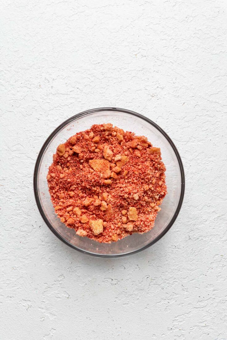 strawberry crumble ingredients mixed in a glass bowl.