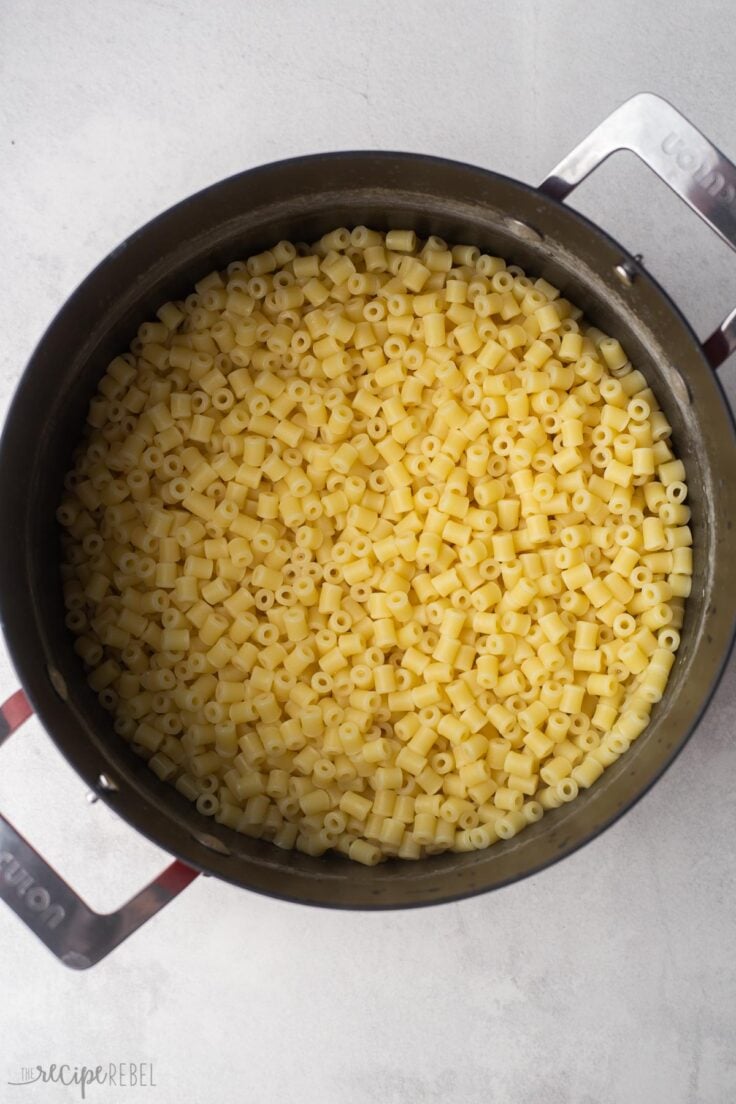 overhead shot of pot filled with cooked ditalini pasta.