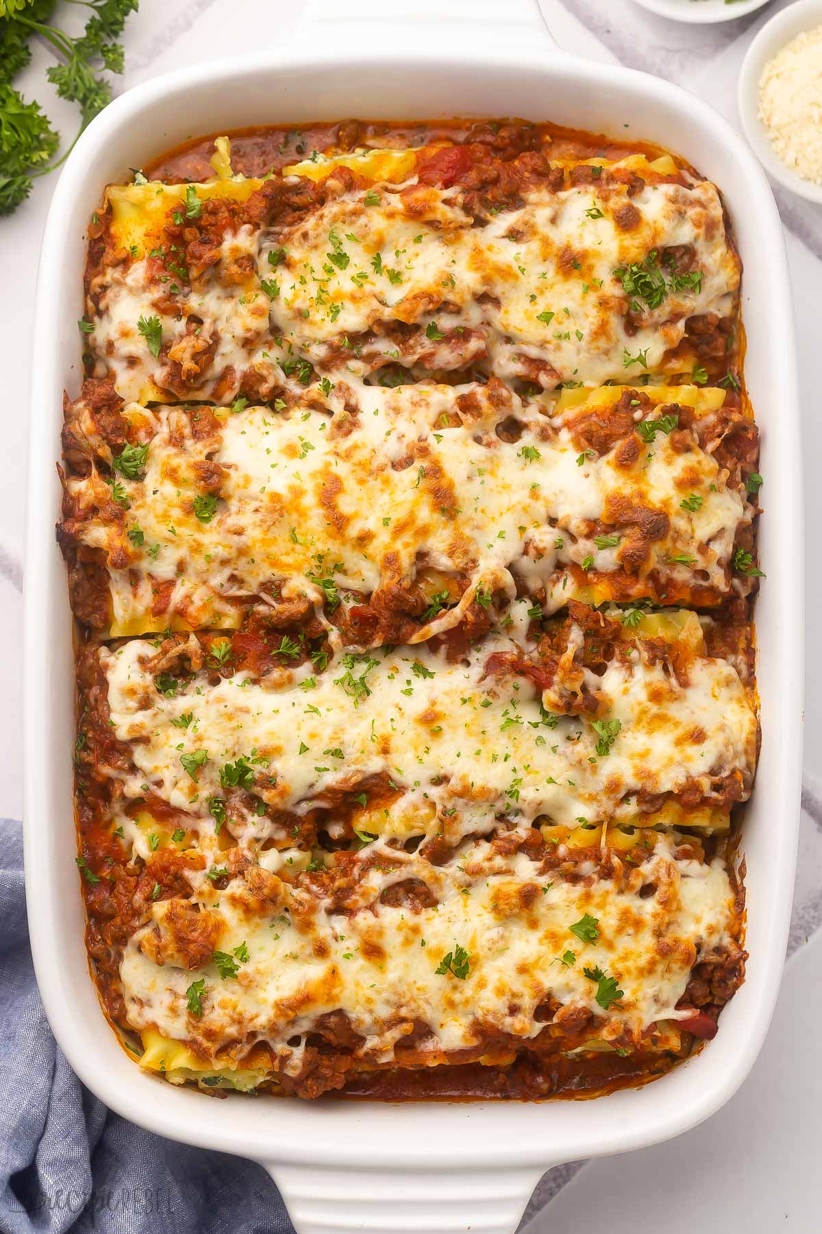 overhead shot of a full dish of lasagna roll ups.