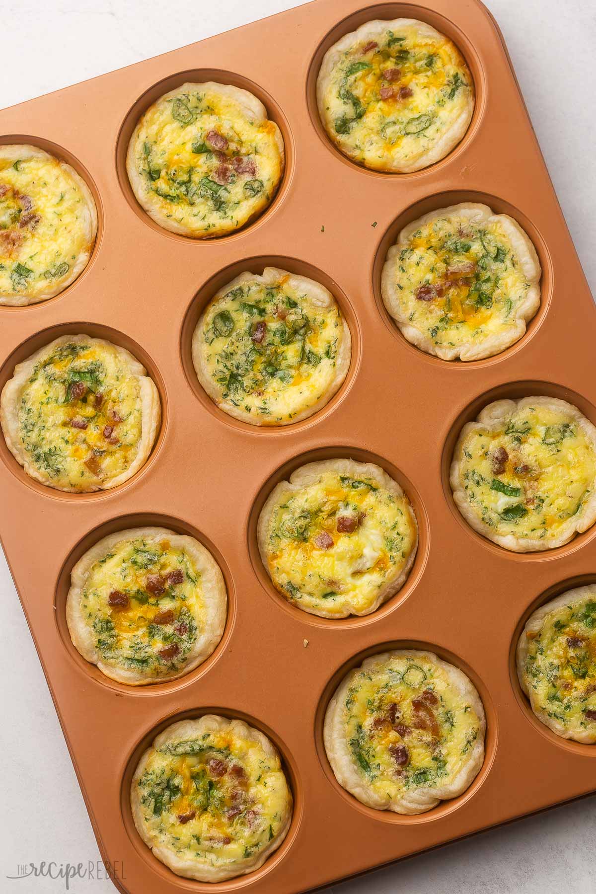 freshly baked mini quiche still in pan.