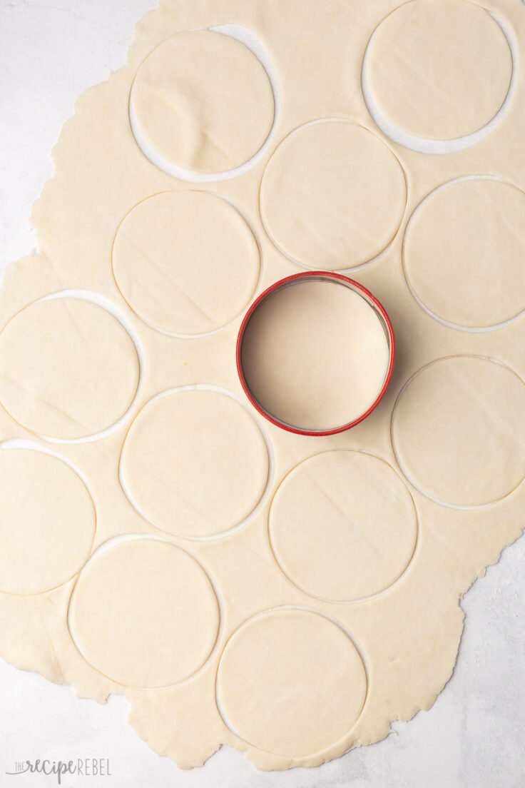 rolled out dough cut into circles with cookie cutter.