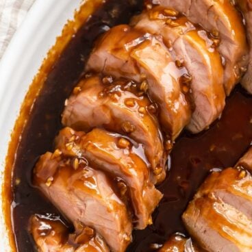 square image of honey garlic pork tenderloin recipe sliced.