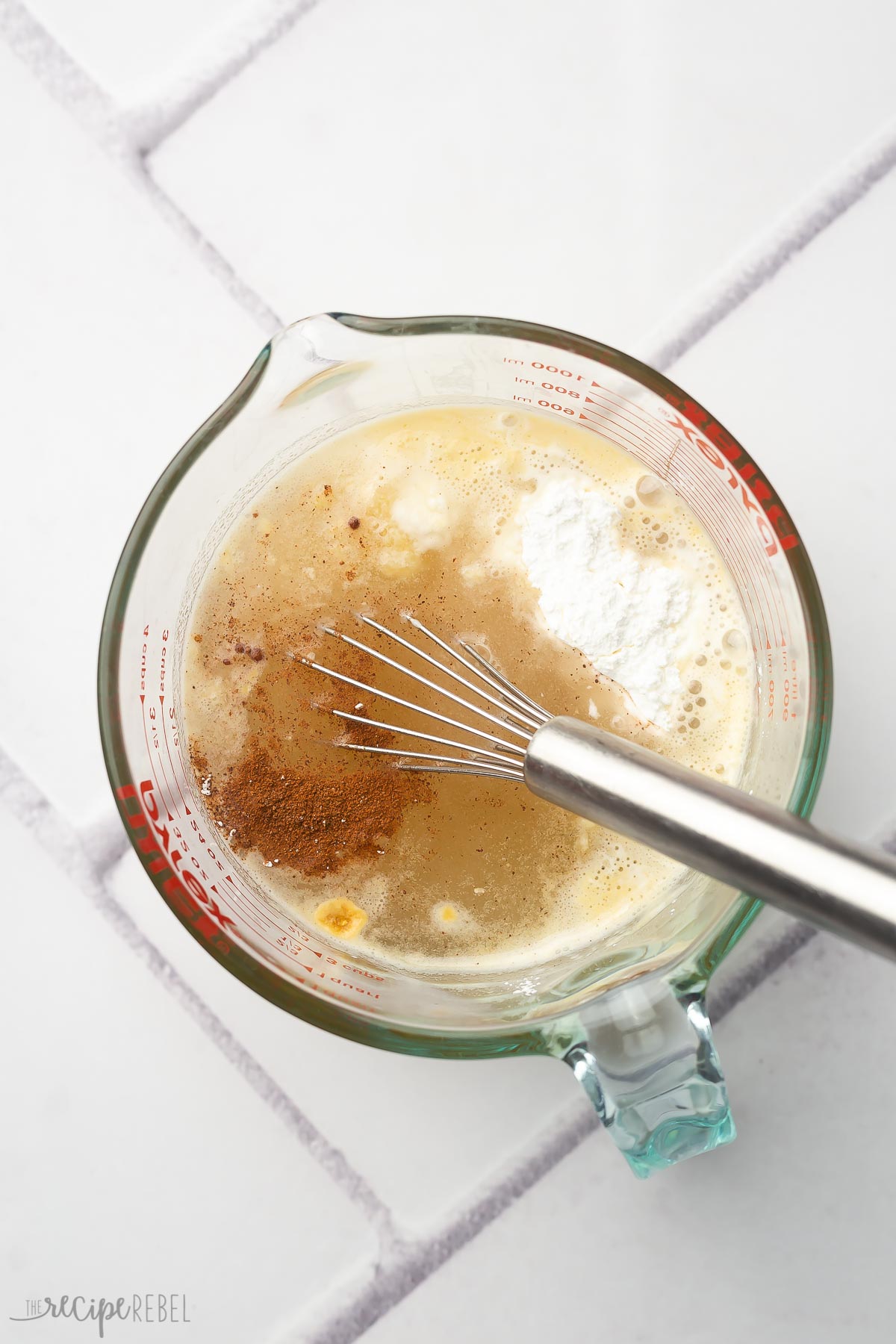 glass measuring cup filled with ingredients to be mixed.