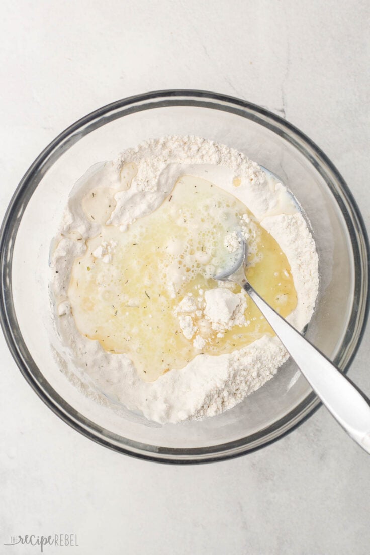 glass bowl of unmixed dough ingredients for soup dumplings.