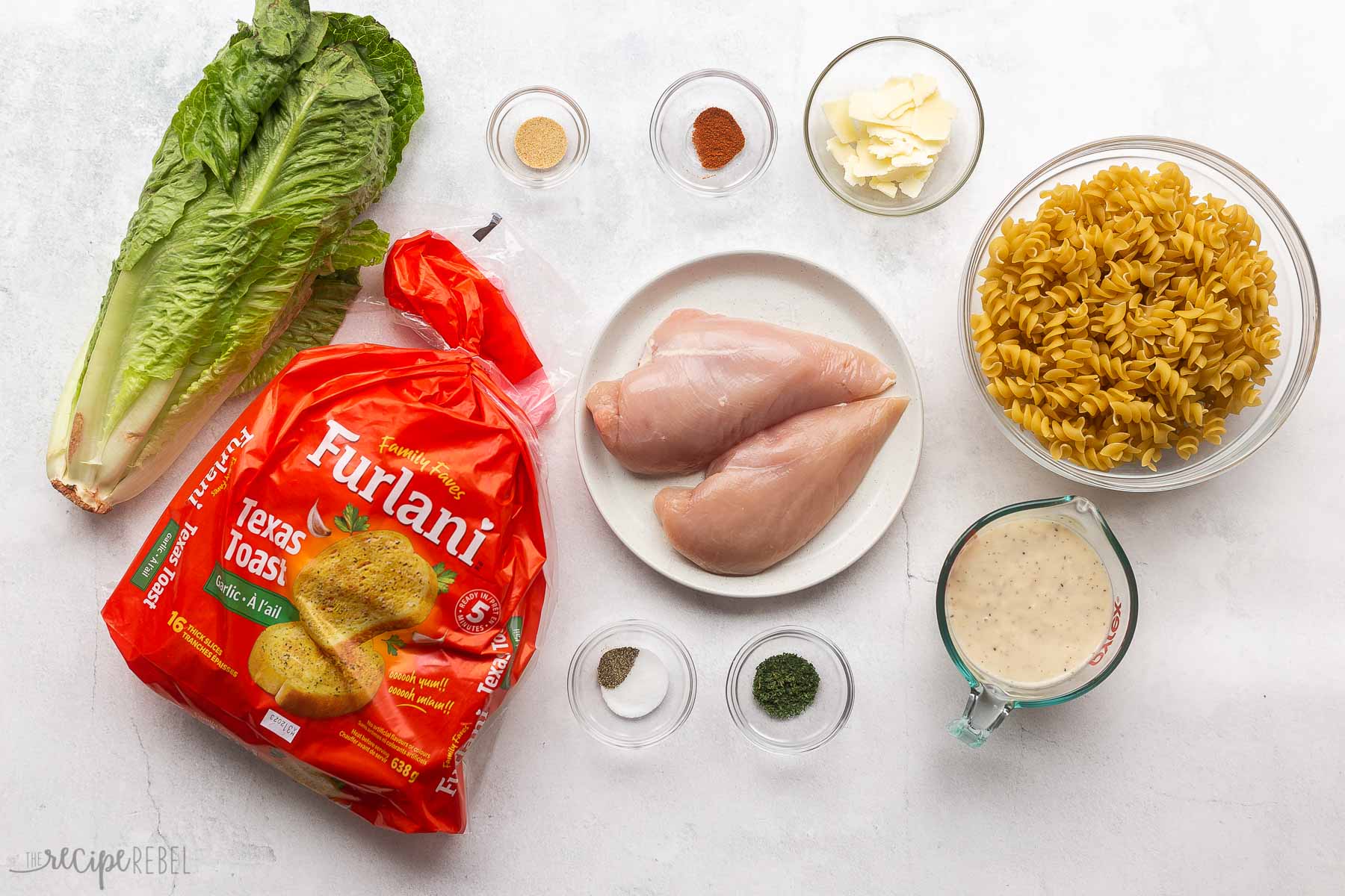ingredients needed to make chicken caesar pasta salad.
