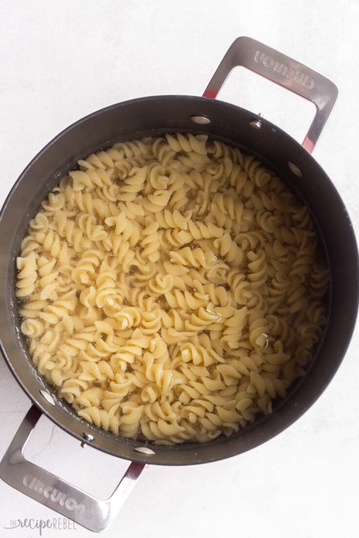pasta being cooked in a large pot of water.