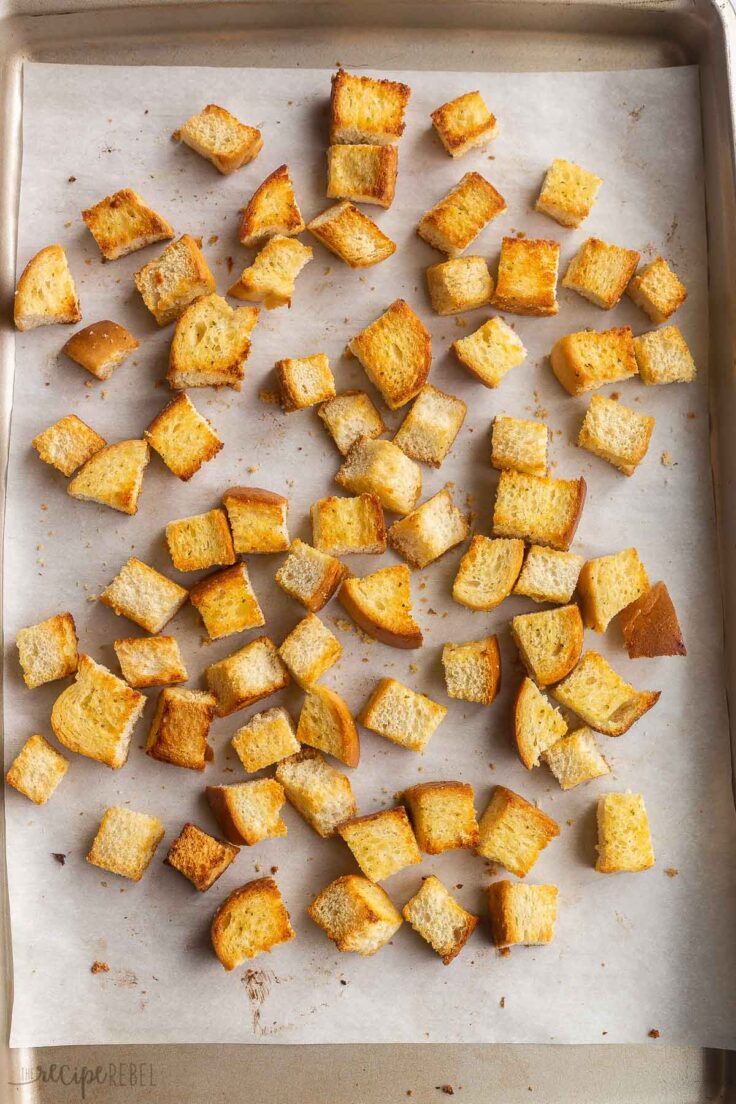 croutons being baked on a sheet pan.