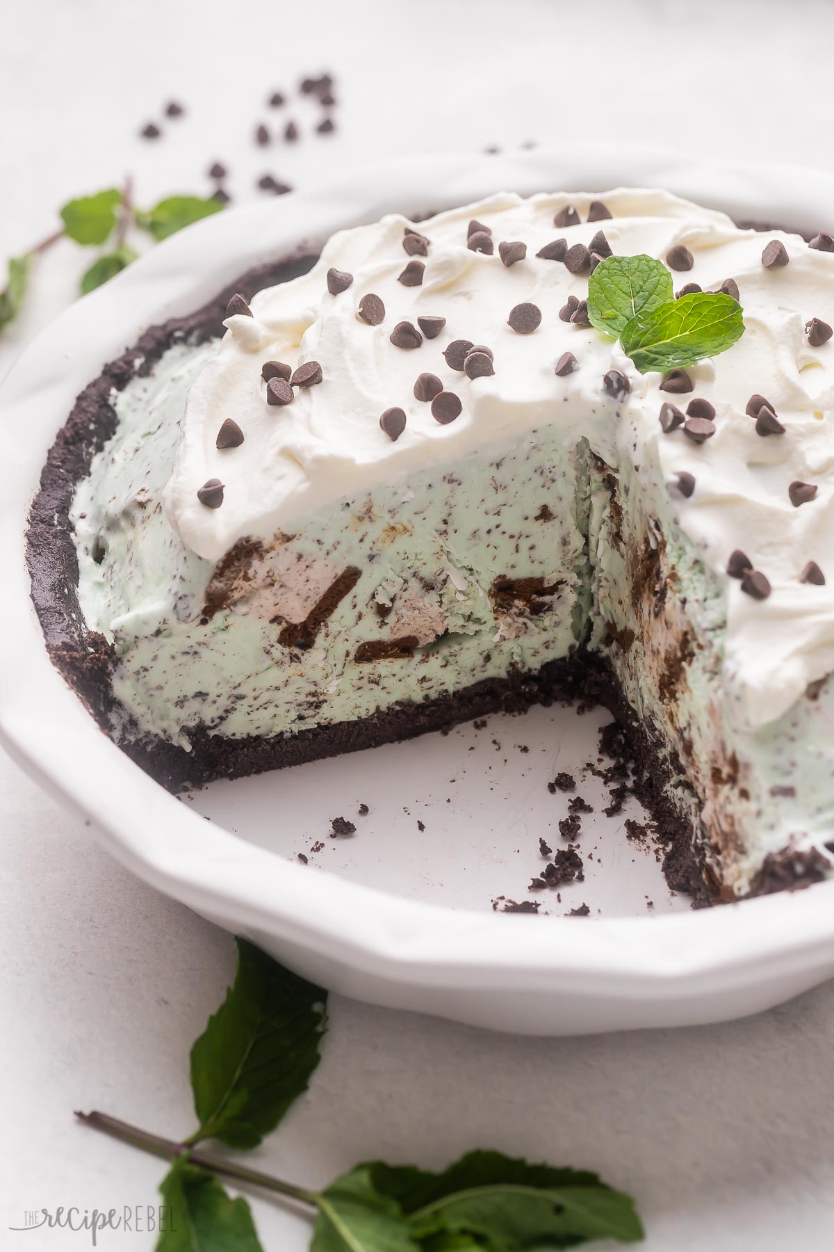 pie plate of grasshopper ice cream pie with piece removed.