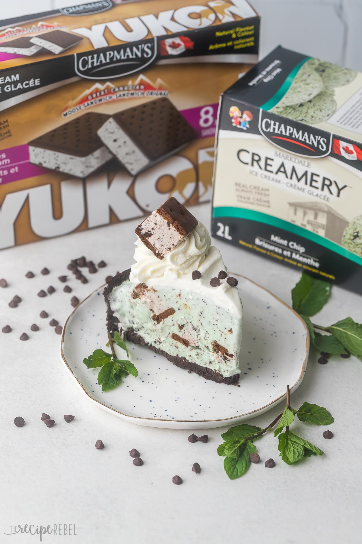 slice of ice cream pie with ice cream sandwich box and ice cream carton.