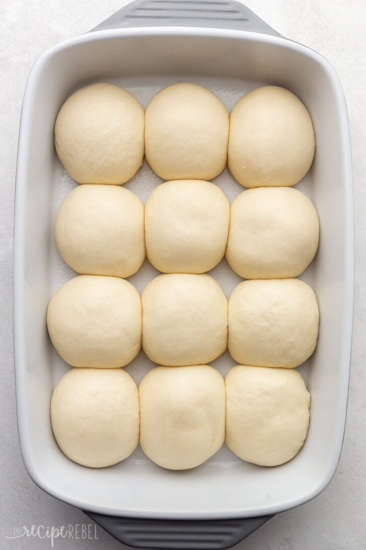 unbaked dough in white baking dish on white surface.