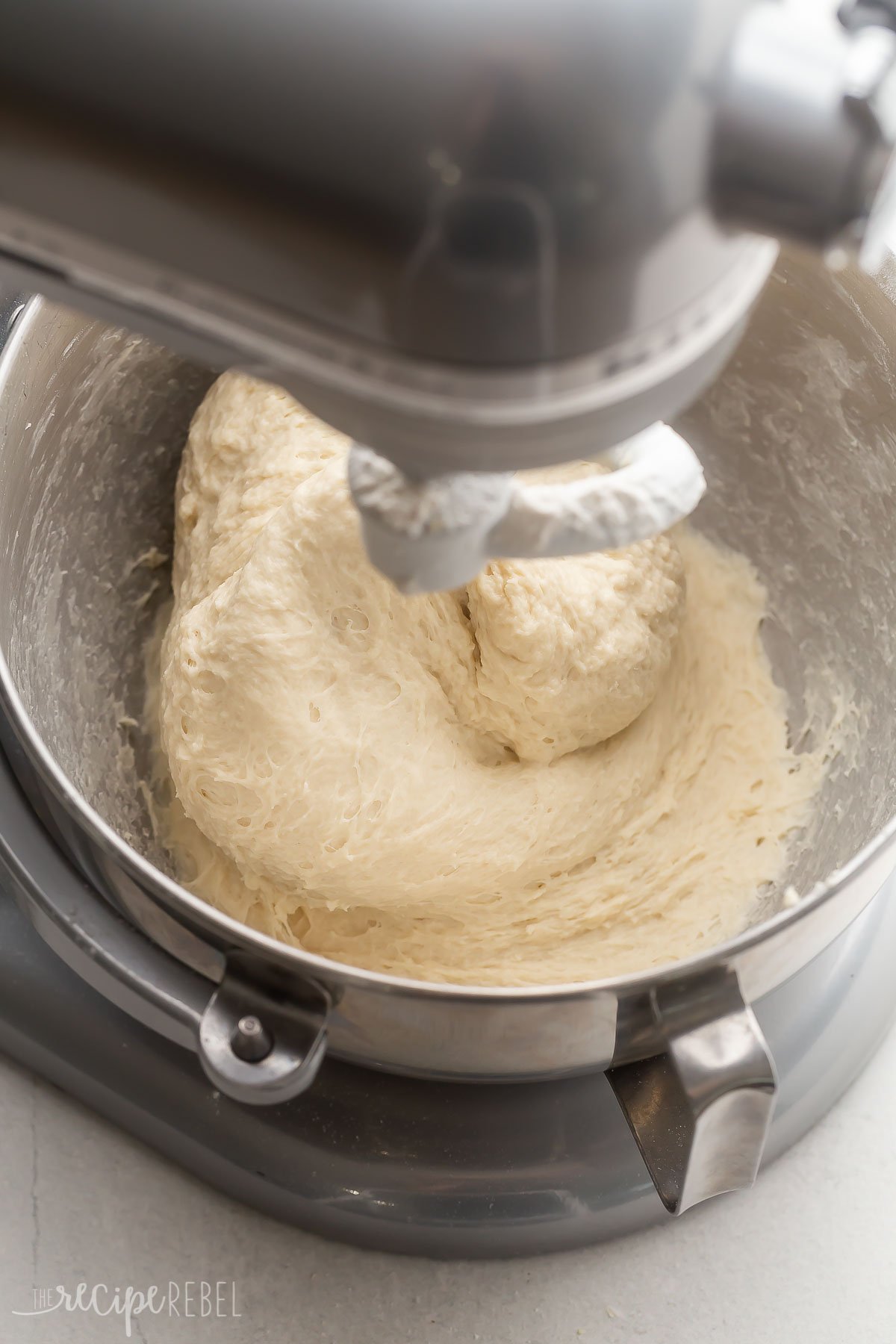 dough finished mixing in steel bowl.