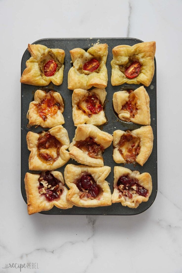 Top view of baked brie bites in a mini muffin pan.