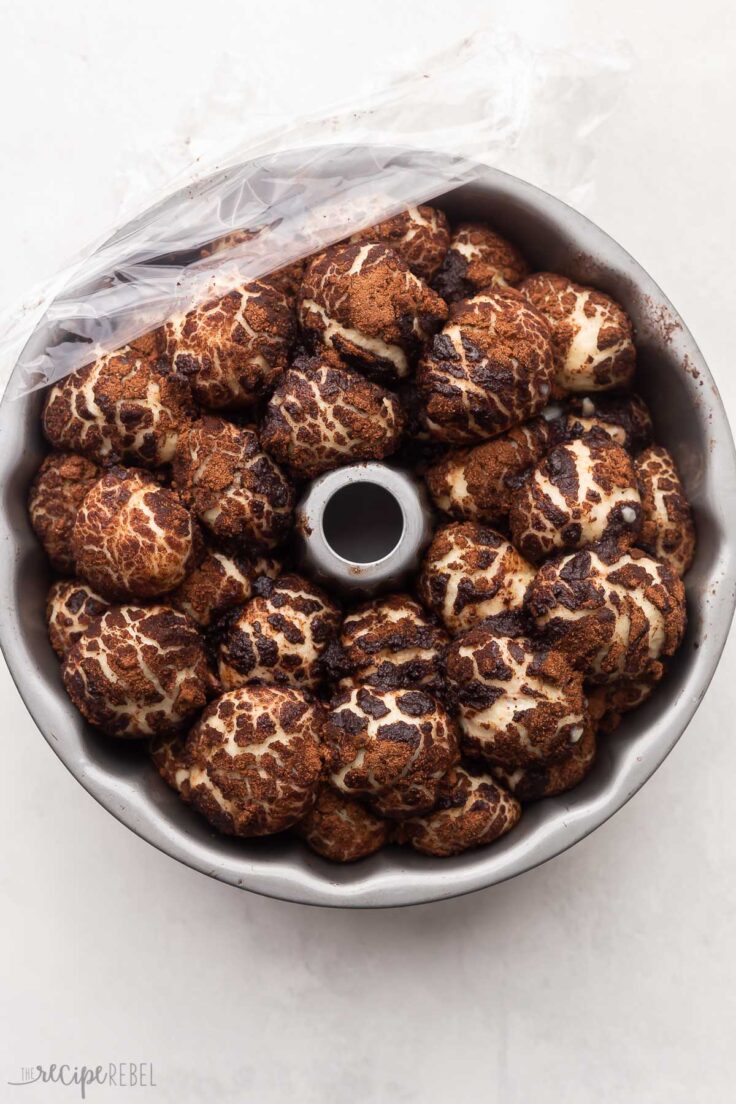 pan with chocolate monkey bread dough risen to the top.