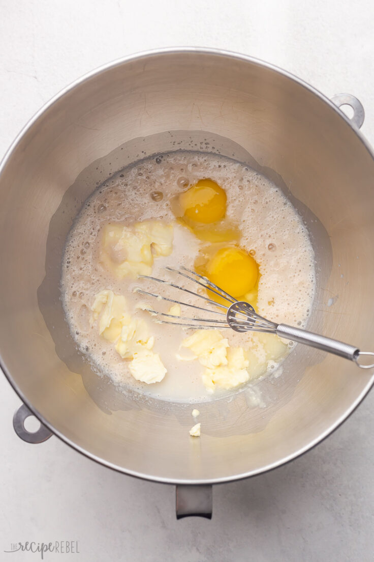 steel mixing bowl whisk and unmixed ingredients.