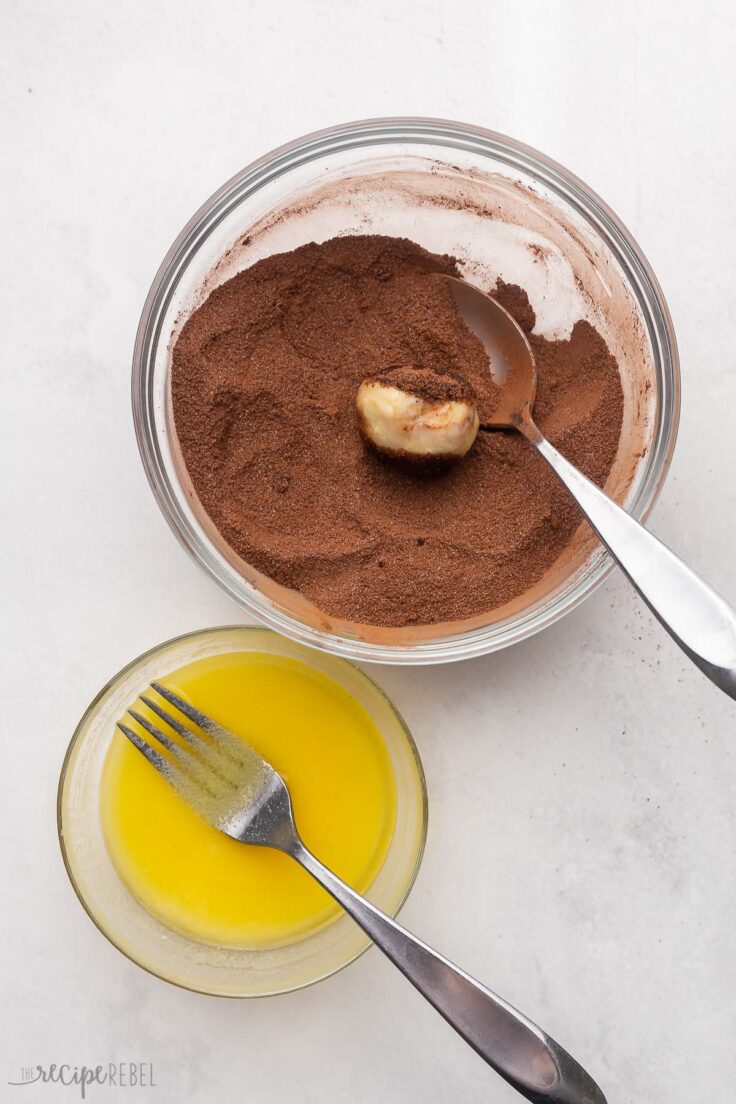 bowl of melted butter and chocolate coating with dough ball in.