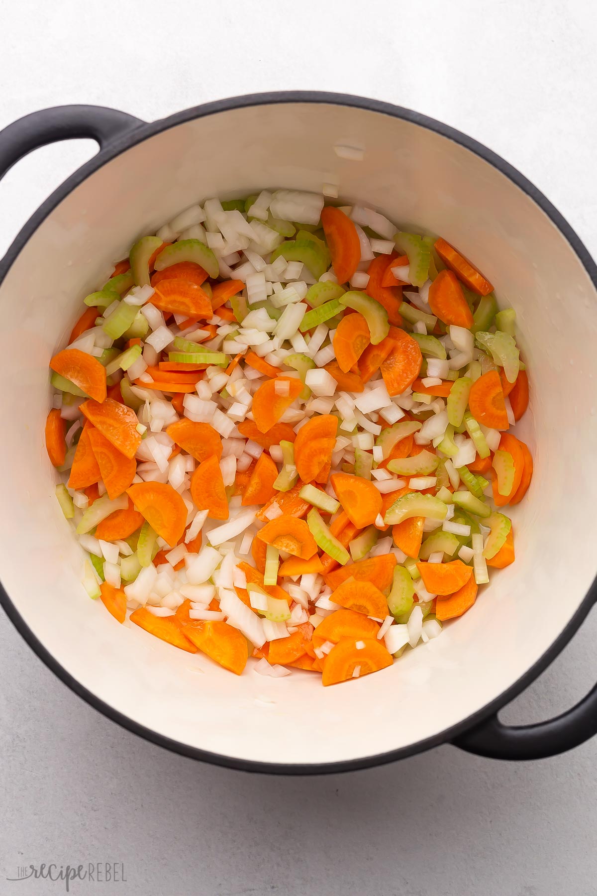 large pot filled with chopped vegetables.