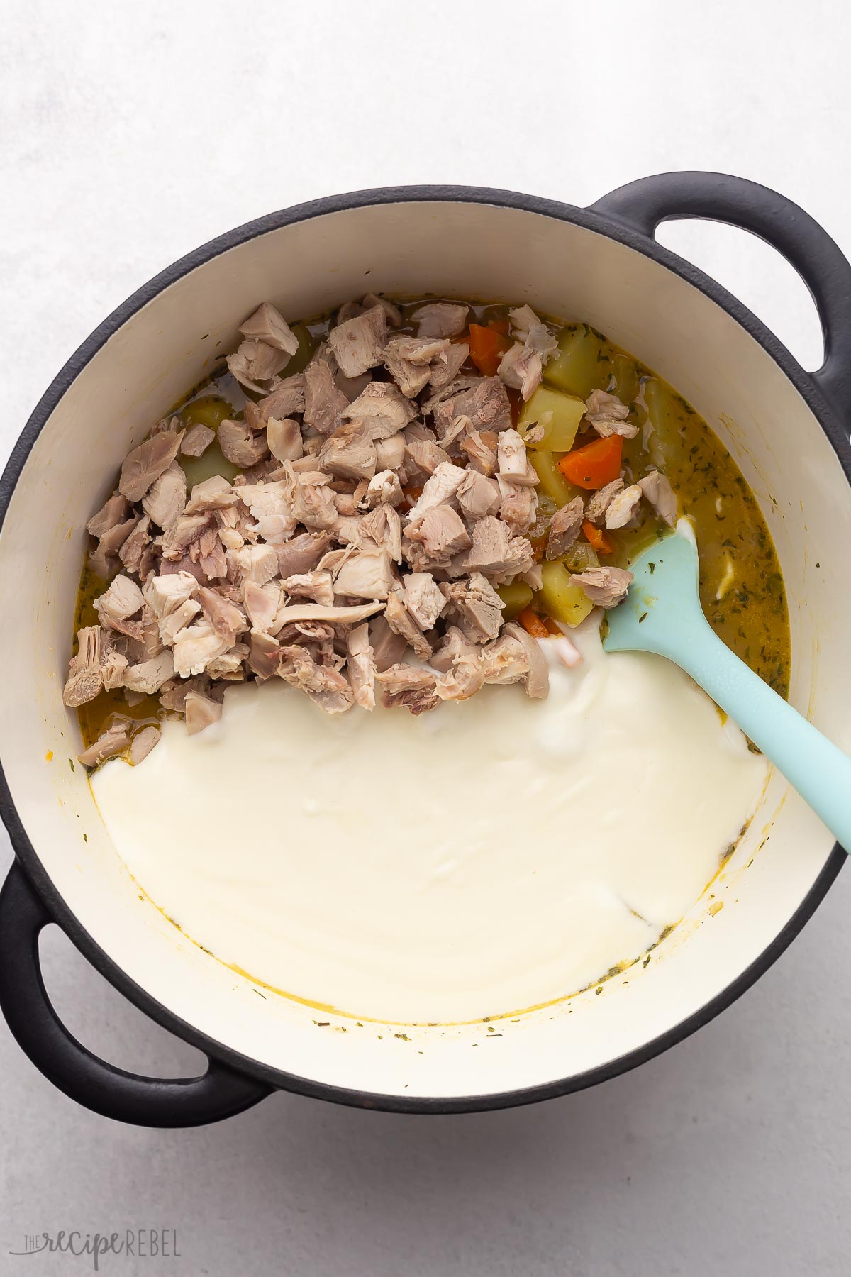 chopped turkey added to unstirred pot of leftover turkey soup.