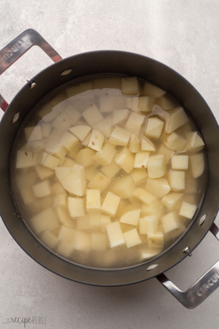 large pot filled with water and chopped potatoes.