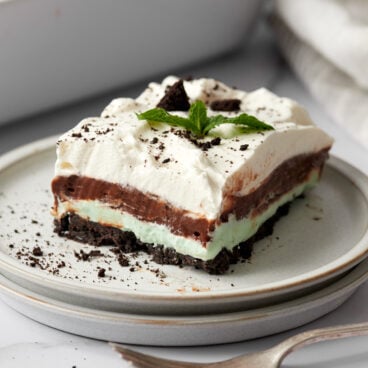 fork and grey plate with piece of chocolate mint lasagna on it.