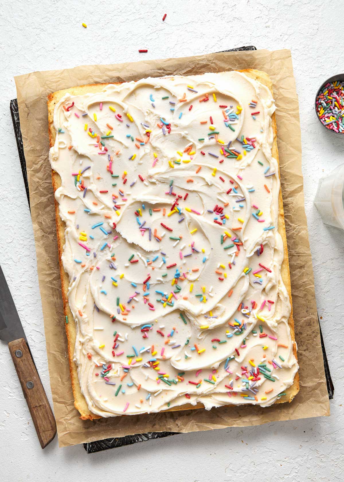 Top view of sugar cookie bars with rainbow.sprinkles on top.