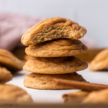 close up of stacked chai cookies with a bite taken out of top cookie.