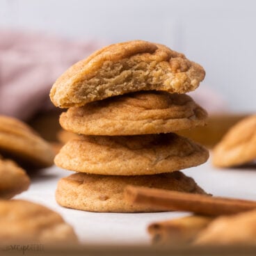 close up of stacked chai cookies with a bite taken out of top cookie.