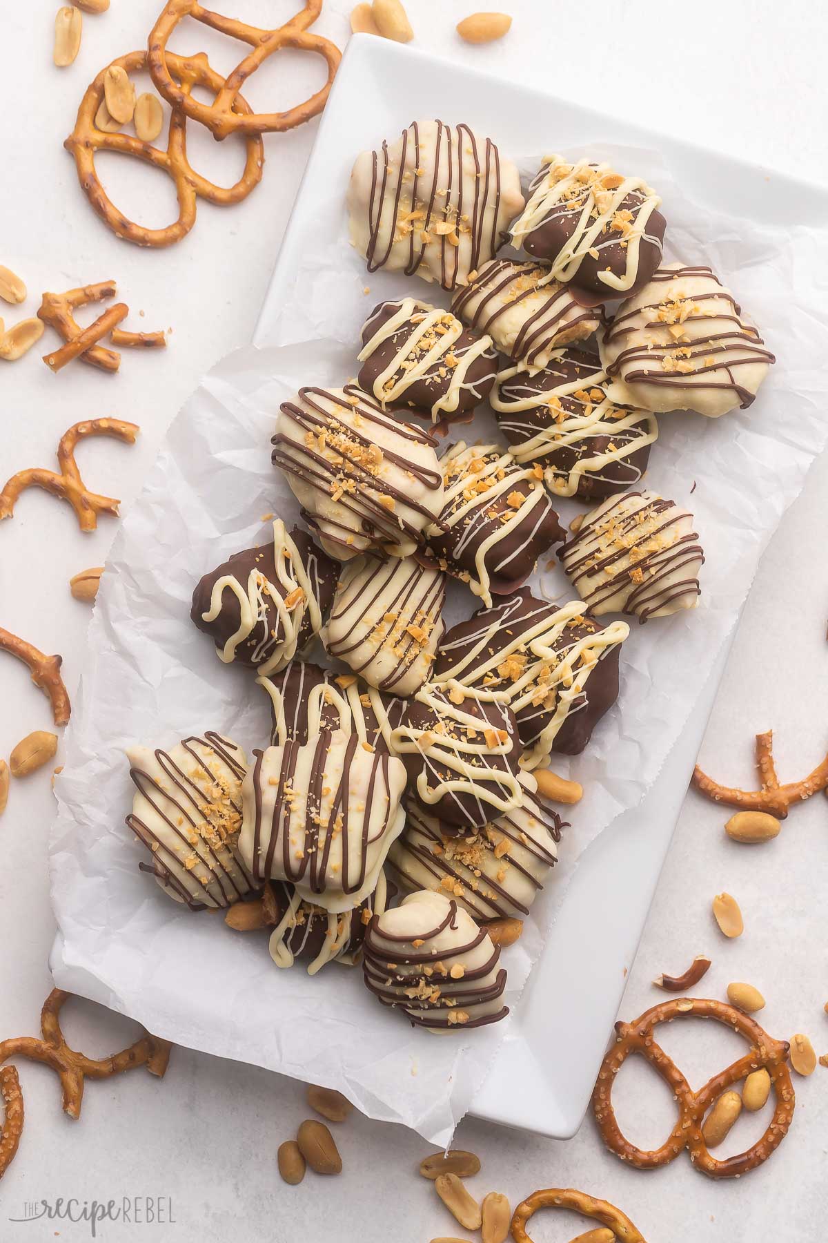 Top view of Chocolate Peanut Butter Pretzel Candies on a white plate.
