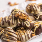 Close-up of Chocolate Peanut Butter Pretzel Candies on a white plate.