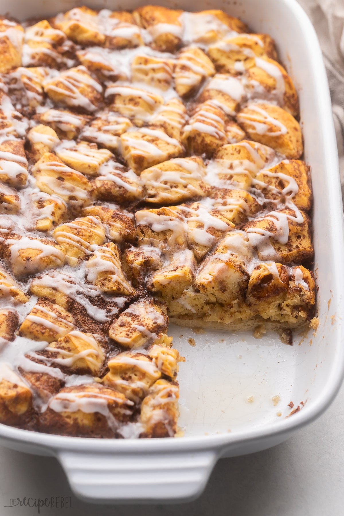 Top view of Cinnamon Roll Casserole with a slice taken out of it.