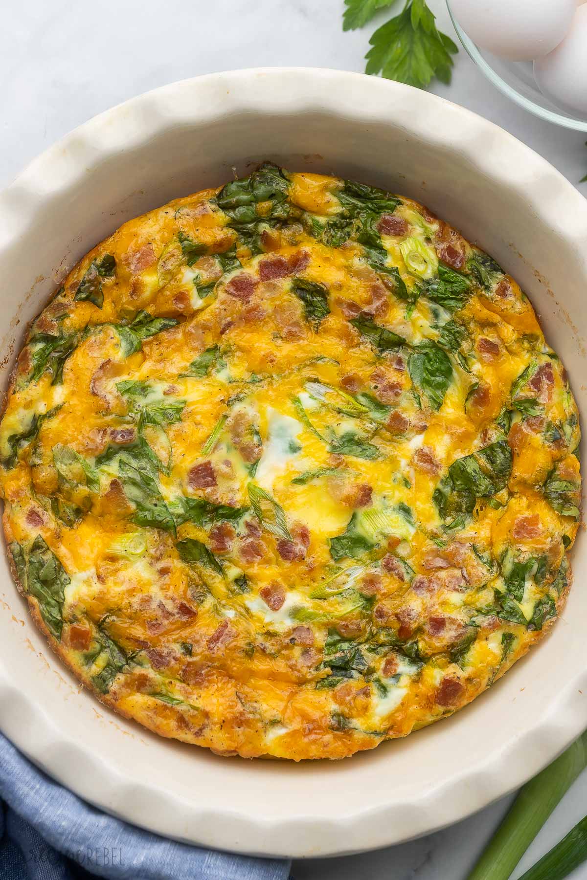 Top view of unsliced Crustless Quiche in a dish.