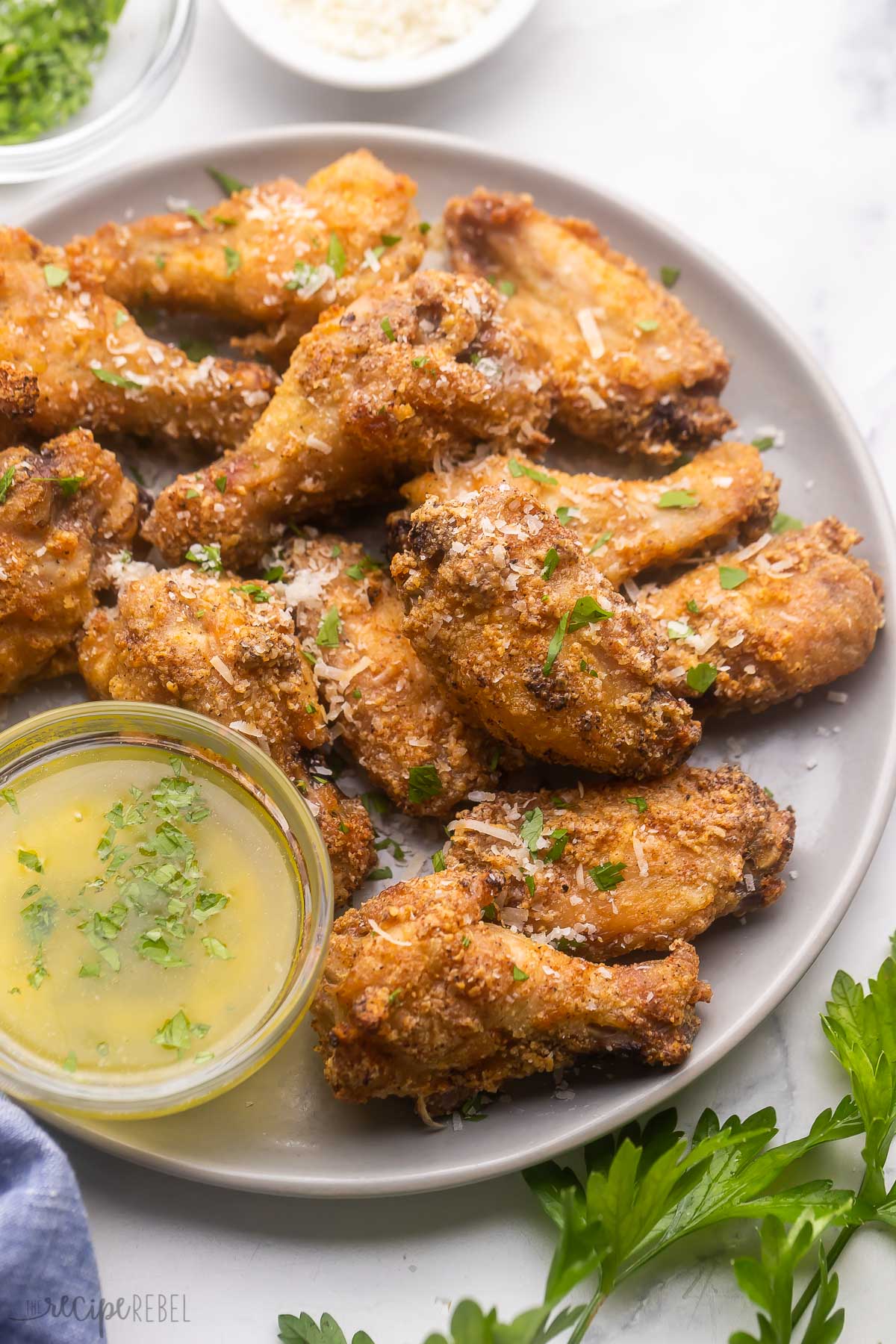 Garlic Parmesan Chicken Wings on a white plate.