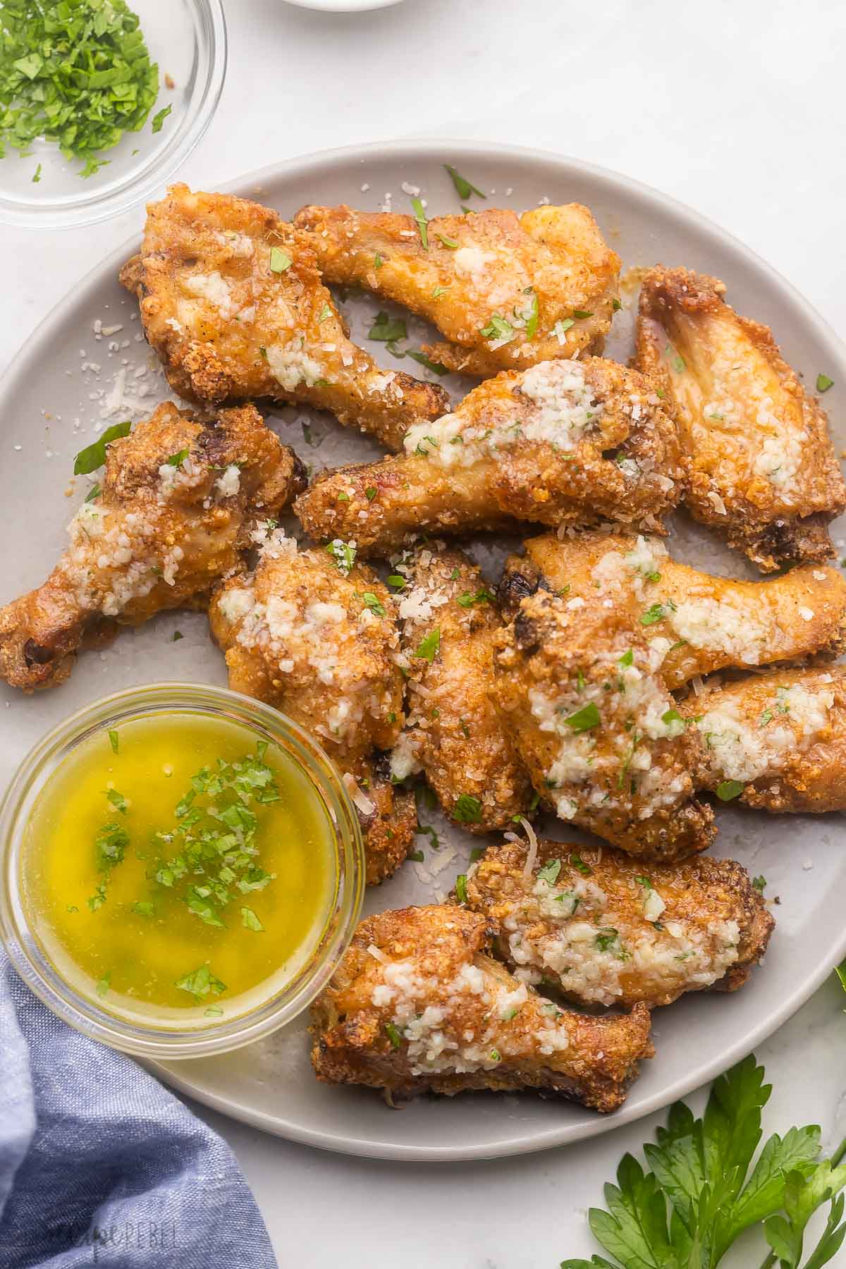 Garlic Parmesan Chicken Wings on a white plate.