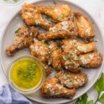 Garlic Parmesan Chicken Wings on a white plate.