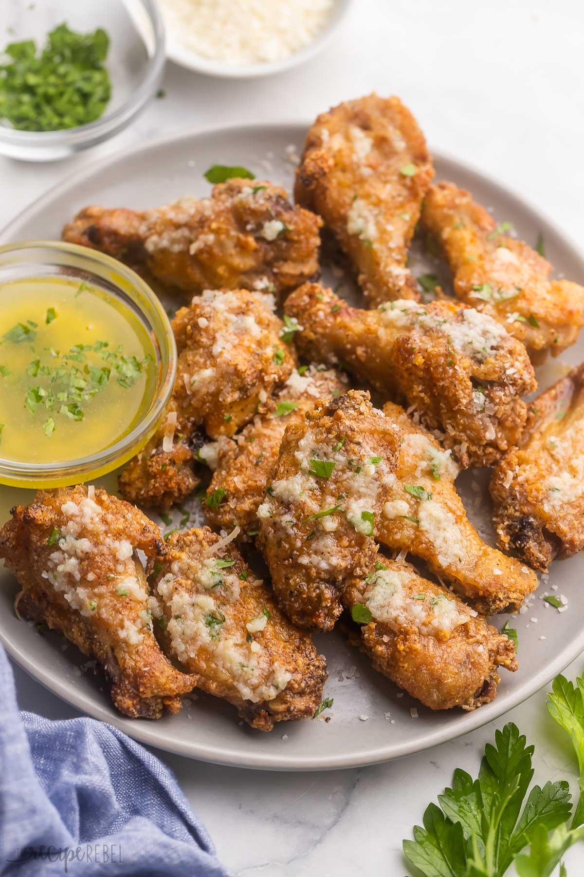 Garlic Parmesan Chicken Wings on a white plate.
