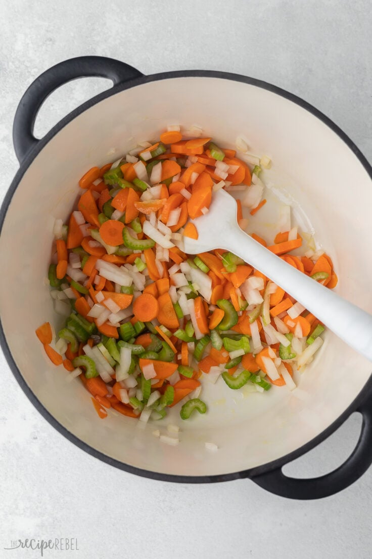 pot full of vegetables and white spatula.