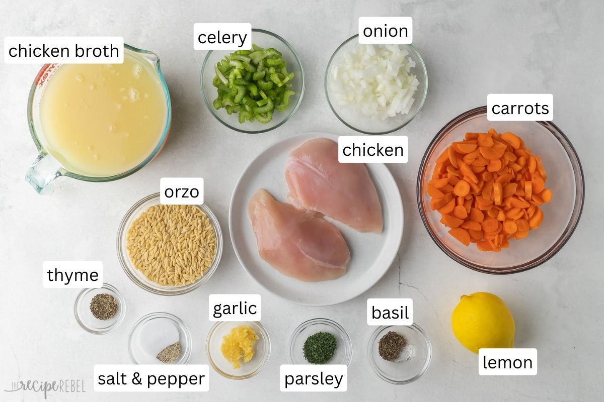 ingredients for lemon chicken orzo soup in glass bowls.