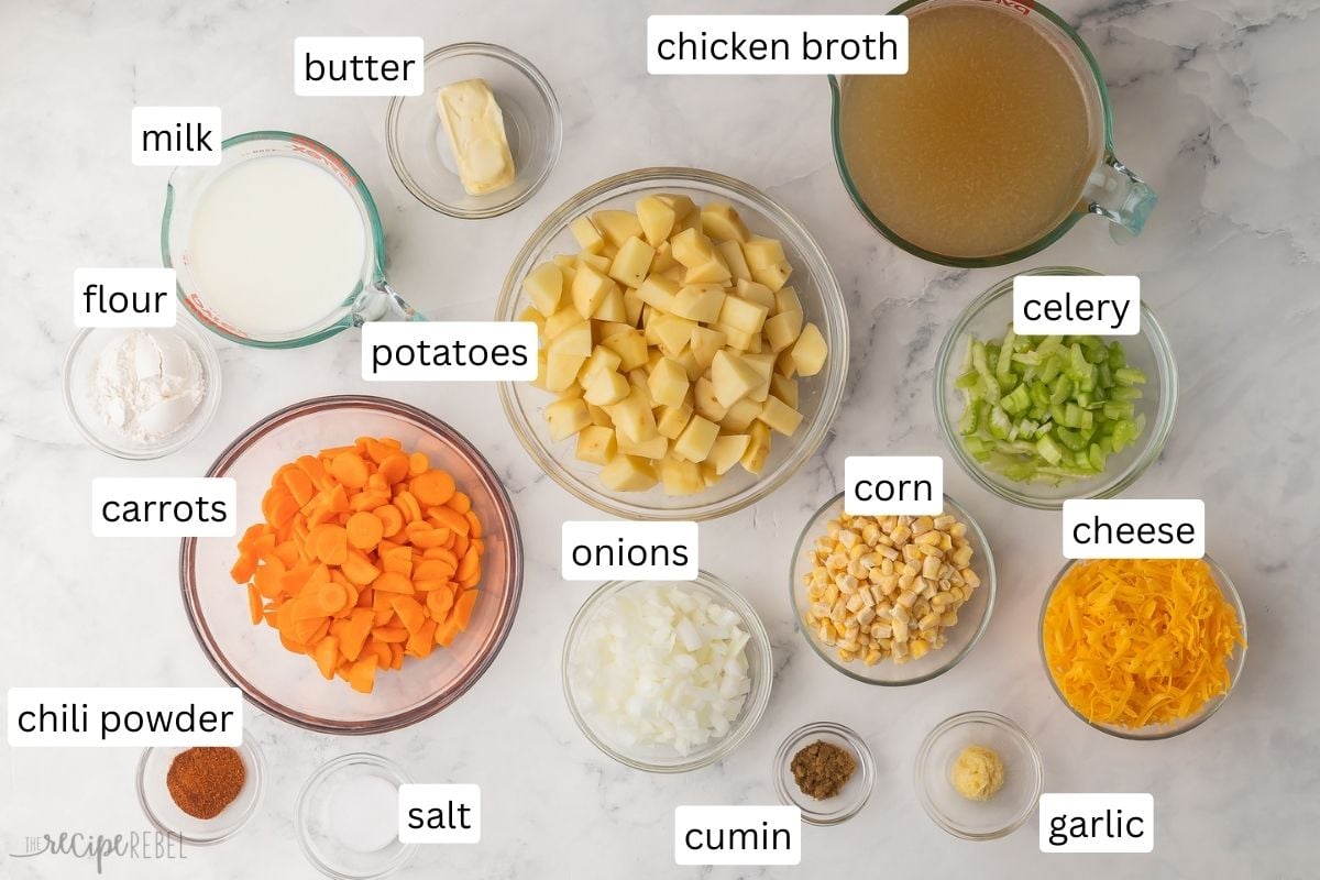 ingredients for nacho potato soup in glass bowls on grey surface.