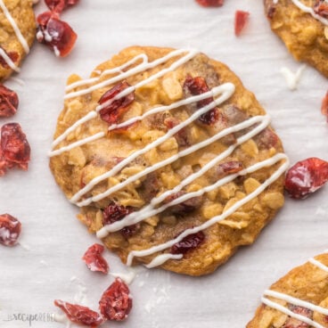 Top view of Oatmeal Cranberry Cookies on a white surface.