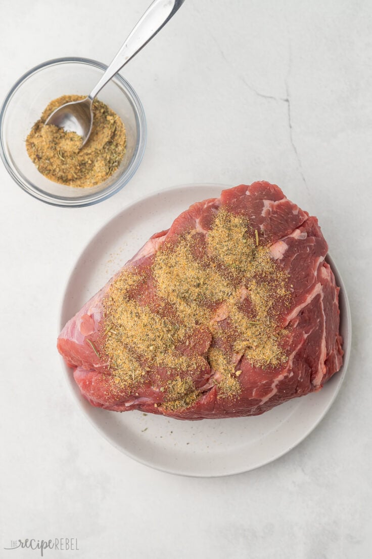 Top view of beef roast with seasoning on it.