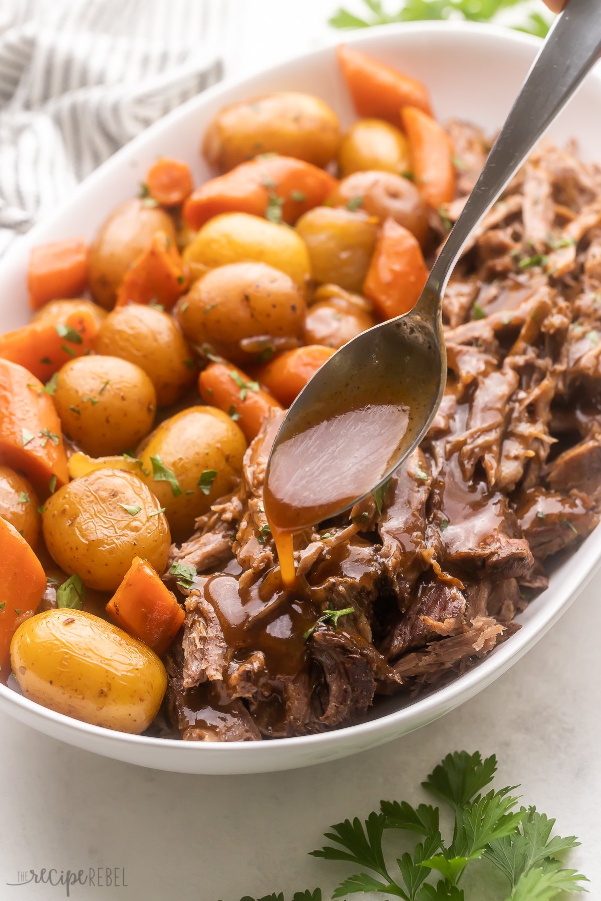 Top view of Pot Roast served in a large white serving dish.