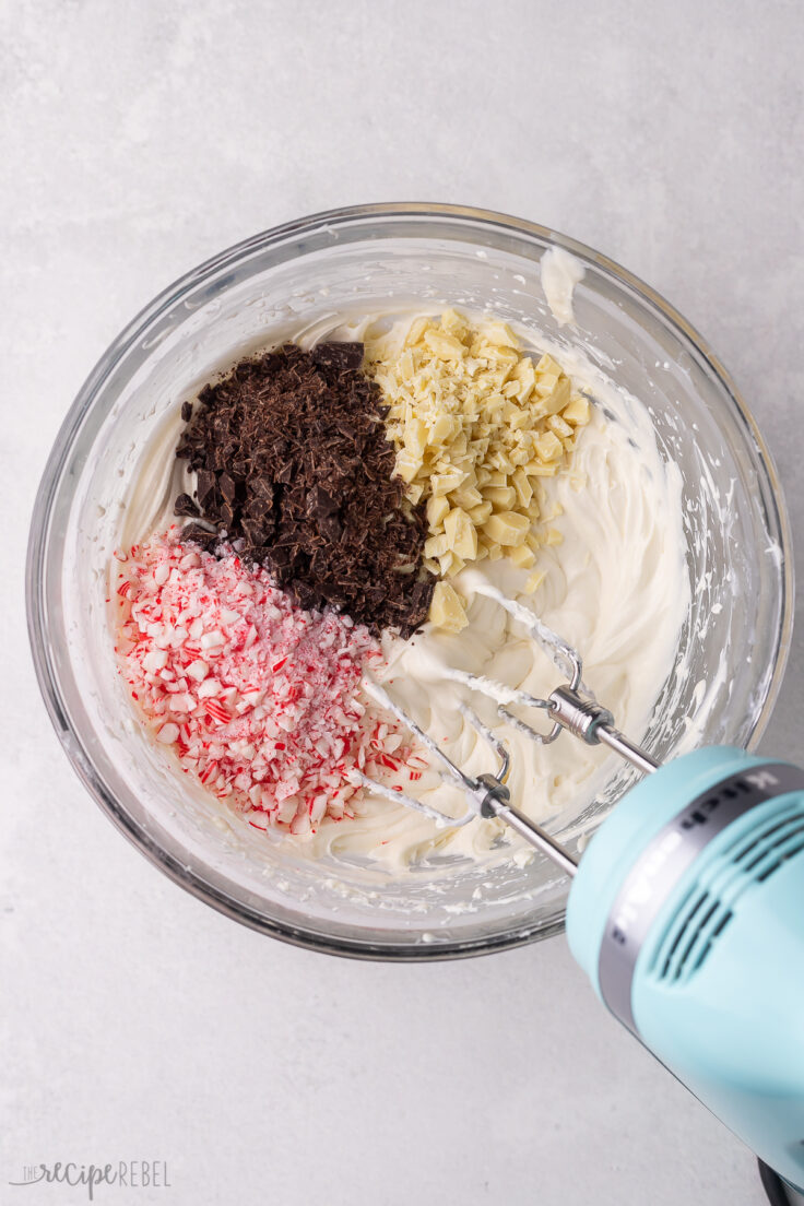 chocolate and crushed candy cane added into glass mixing bowl.