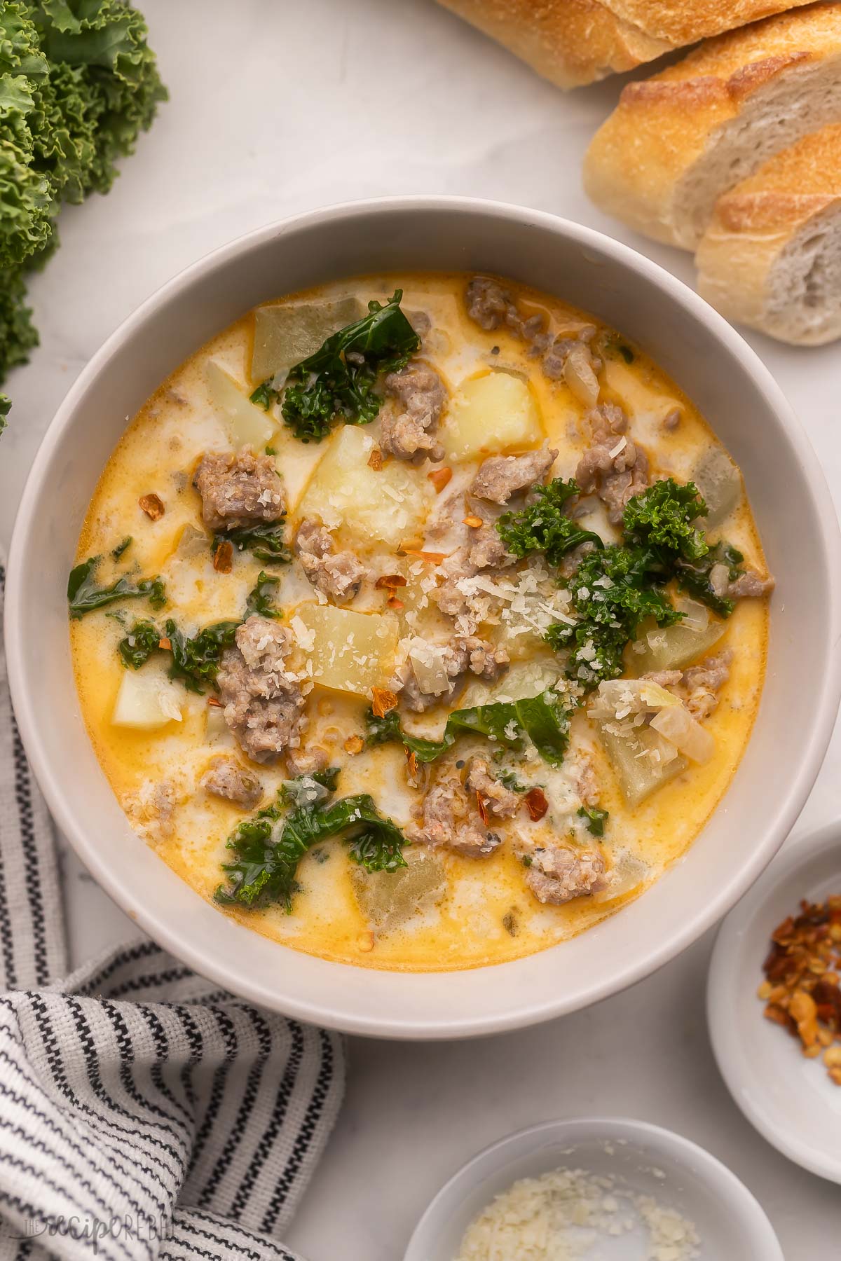 overhead image of bowl of crock pot zuppa toscana soup.