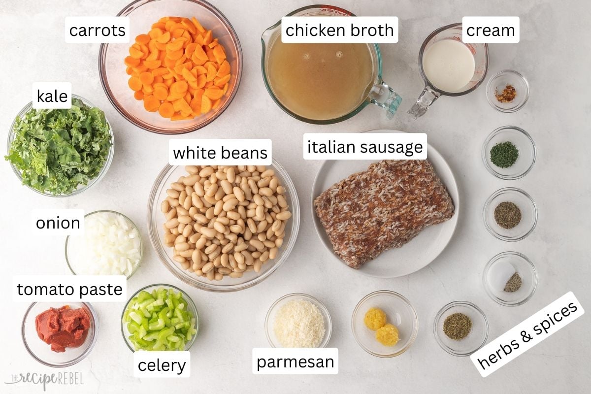 ingredients needed to make tuscan white bean soup on a white background.