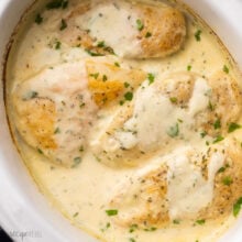 close up of creamy garlic chicken in white slow cooker.