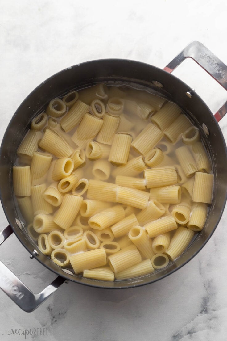 large pot filled with water and cooked pasta.