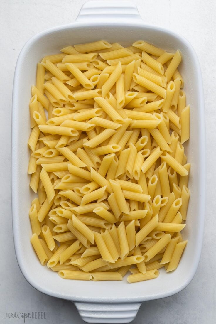 white baking dish filled with cooked pasta.