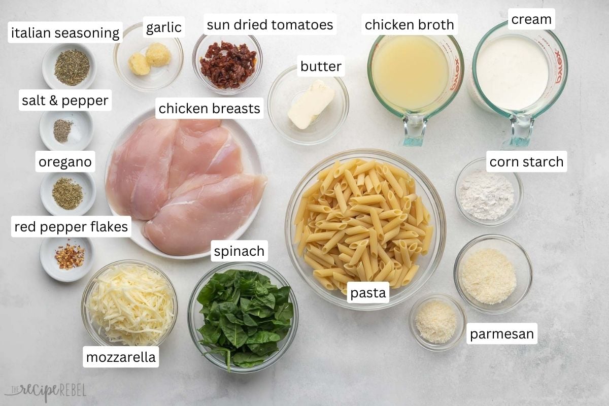 ingredients needed for tuscan chicken pasta bake in glass bowls.